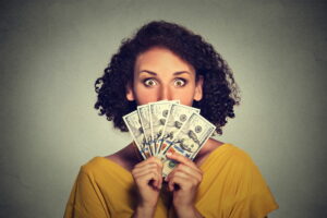 woman-holding-dollar-bills