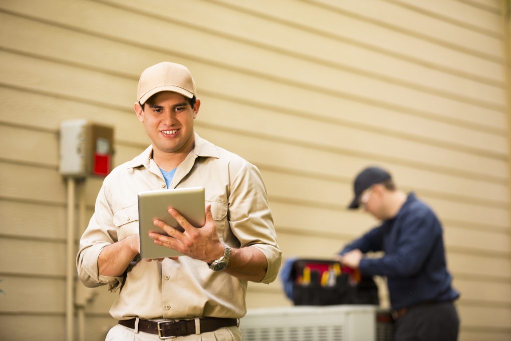 2 Techs Working on Heat Pump