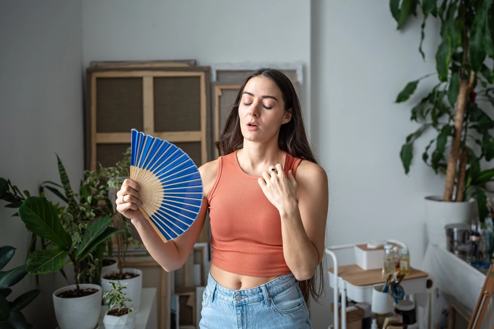 Woman suffering from indoor heat